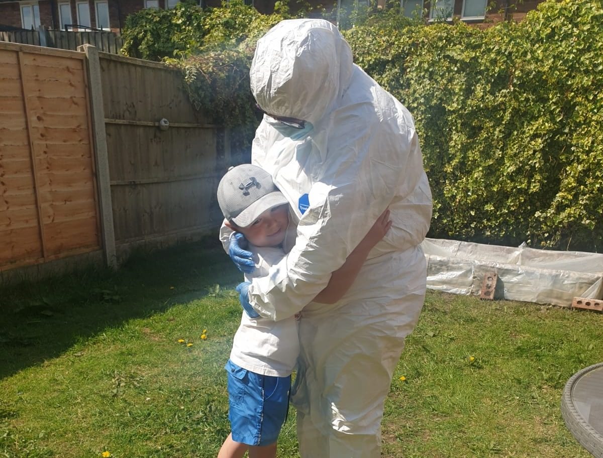 Watch as Scouse nan dresses in protective suit to give grandson a surprise lockdown hug