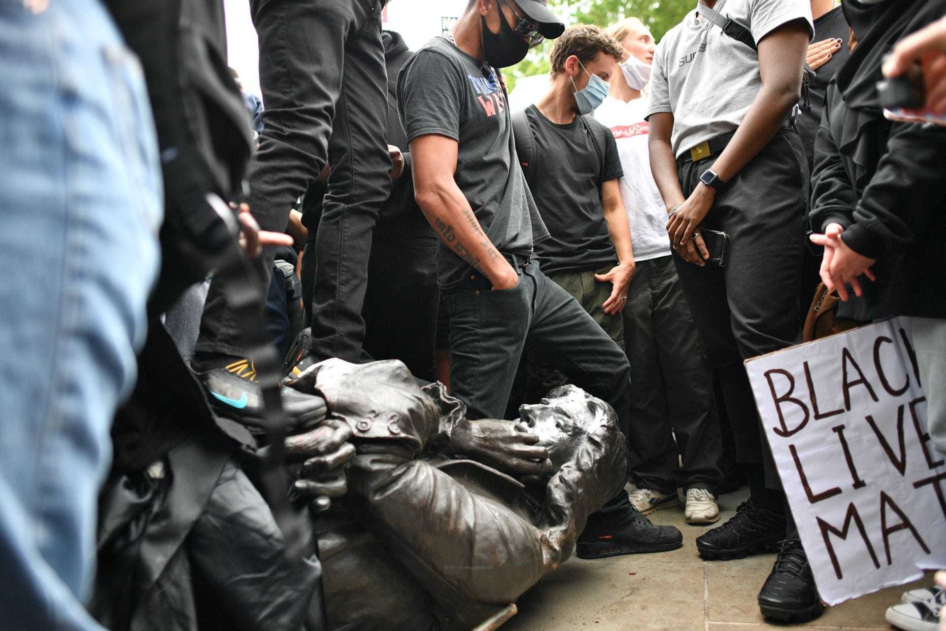 Protesters in Bristol pull down statue of slave trader and push it into harbour