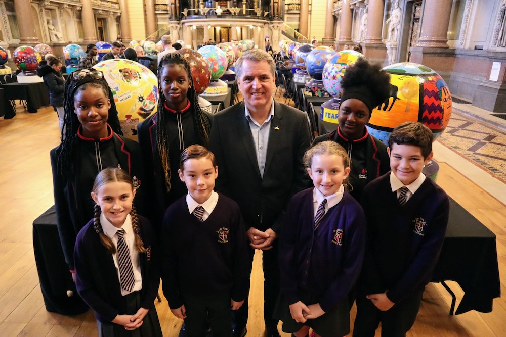 School children and community groups gather at St George’s Hall for Black History Month – with 40 decorated globes they helped design