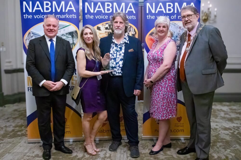L-R are Simon Baynes MP - Chairman of the All Parliamentary Markets Group, who presented the award to the Council’s Adele Thomas - Chester Market Manager and Rob Monaghan - Strategic Markets Manager with Katherine Brown from Award Sponsors Blachere Illumination and Councillor Chris Poulter, President of NABMA.