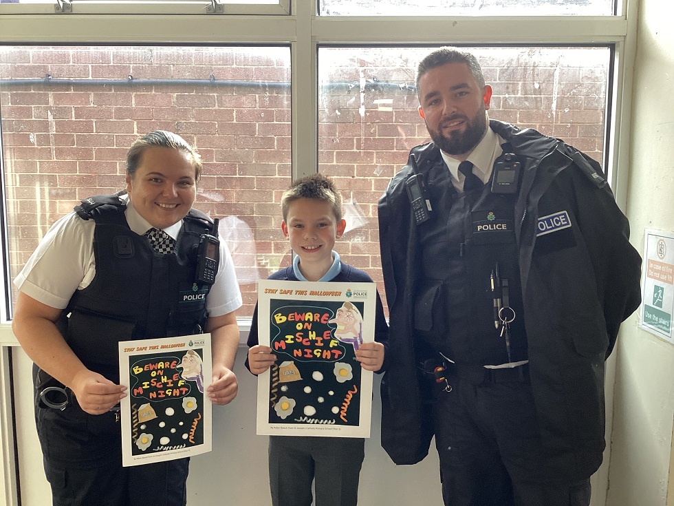 PC Emily Scarratt and PC Samuel Hanson with Adam Beech from St Josephs in Wirral