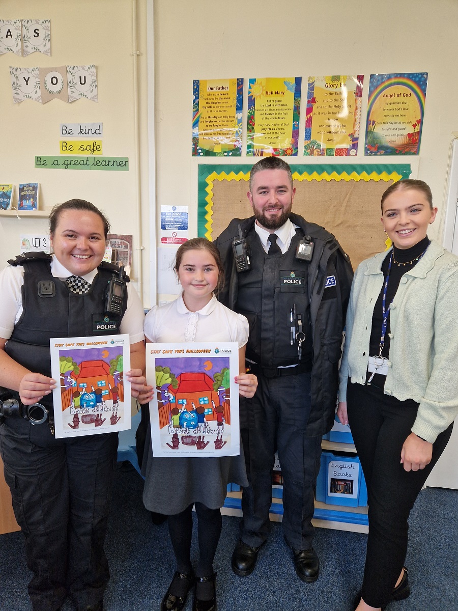 PC Emily Scarratt with Lily-Rose Neale, PC Samuel Hanson and Miss McCallion from St Michaels in Wirral