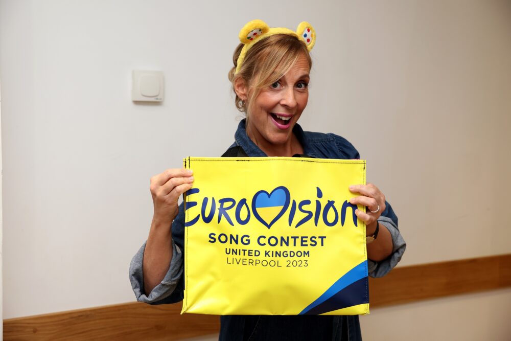 Mel Giedroyc with one of the Eurovision bags in support of BBC Children in Need. Credit: BBC