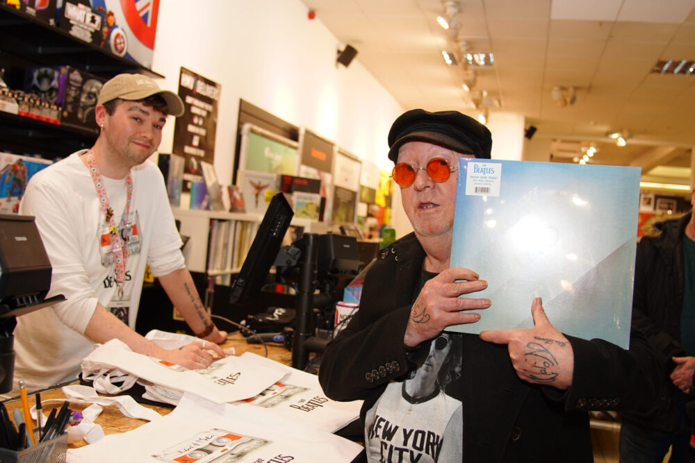 Beatles superfan, John Lennon, who changed his name by deed poll from Alan Williams in April 2022, holds the first copy of the newly released last Beatles song, Now And Then, following a special midnight launch event at HMV Liverpool, allowing fans in the home city of the four Beatles members to be the first to get their hands on the new music. Picture date: Friday November 3, 2023. Picture date: Friday November 3, 2023. Credit: PA