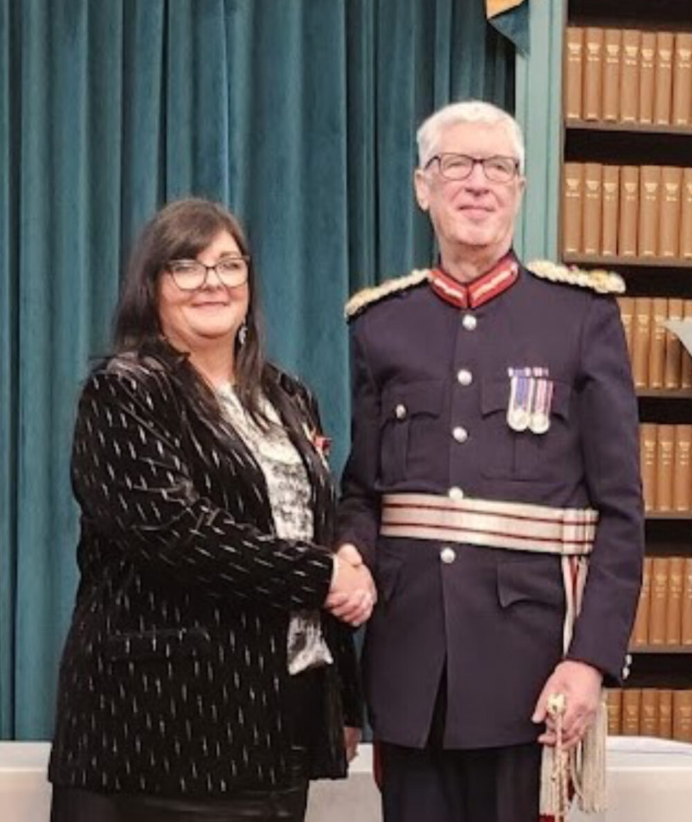 Sally Ralston BEM pictured with the Lord Lieutenant of Liverpool, Mark Blundel. Credit: Merseyrail
