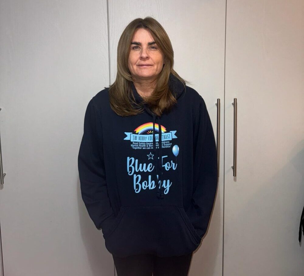 Joanne Colleran in a Blue for Bobby sweatshirt