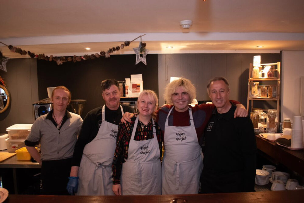 Tim Burgess (centre right) with Michelle Langan (Centre) and the team at Paper Cup Coffee. Credit: Paper Cup Project