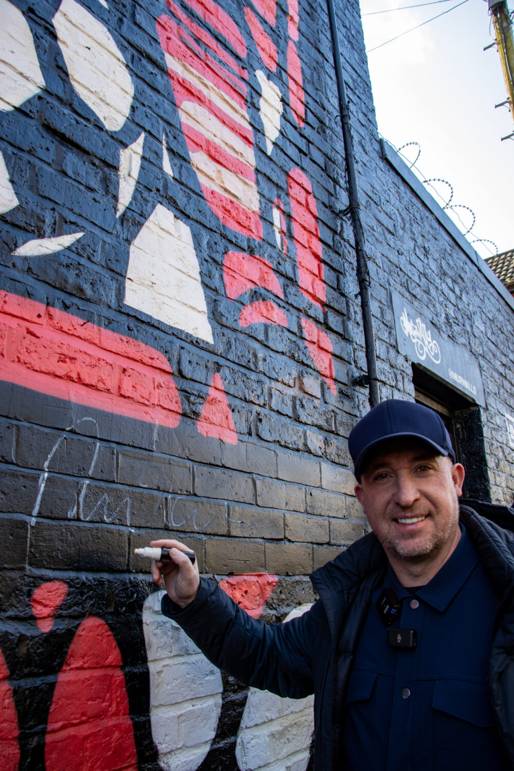 Robbie Fowler and the Anfield mural. Credit: Courtney Neary