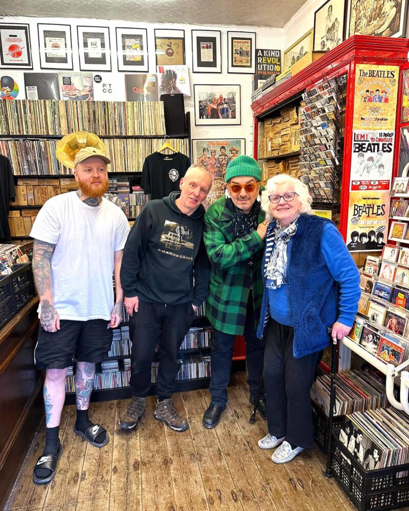 Craig, Tony and Diane in the shop with Elvis Costello