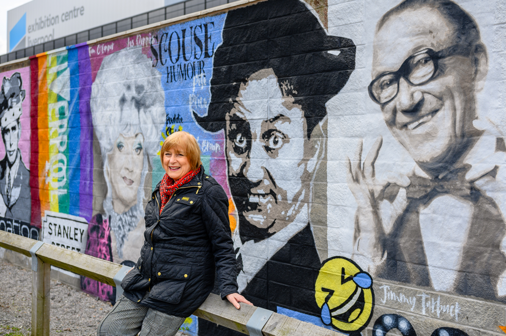 Lady Anne Dodd by the new mural on Liverpool's waterfront. Image courtesy Pete Carr