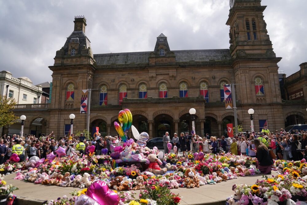 Flowers and tributes have been left outside the Atkinson Art Centre Southport to the young victims. Image: Owen Humphreys/PA.