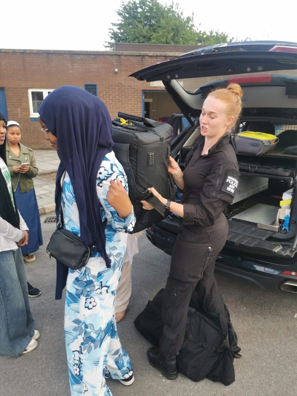 Trying on equipment. Credit: Merseyside Police