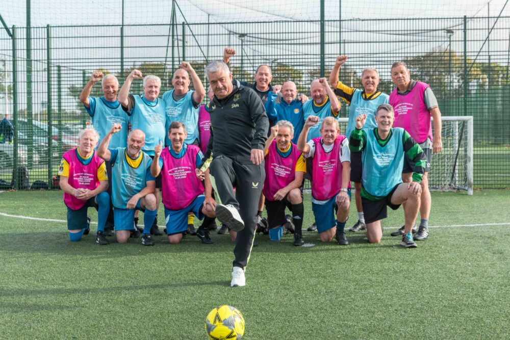 Southport Veterans FC staged a 24 hour walking football challenge to raise money for the three primary schools attended by the three young girls who were killed at The Hart Space in Southport on 29th July 2024. Everton legend Ian Snodin (front) kicks off. Photo by Zack Downey of ZED Photography for Stand Up For Southport