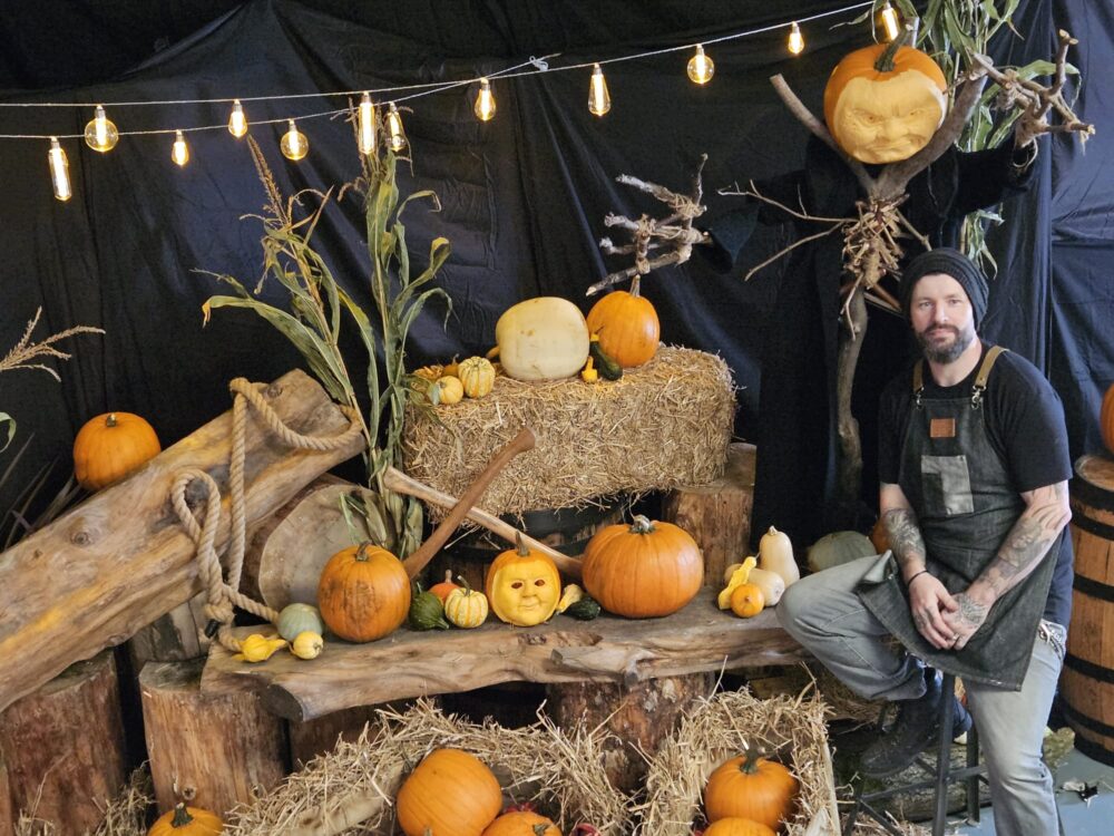 Paul Crawford with carved pumpkins like those guests at Hand On Art can make