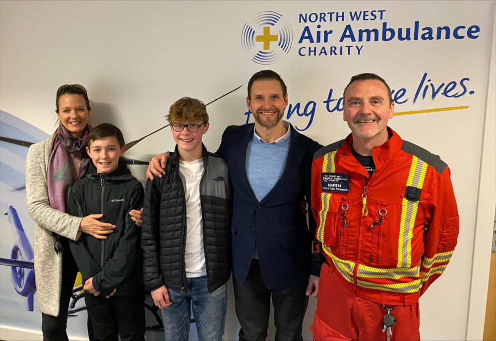 Paul and his family meeting one of the crew members who saved his life.