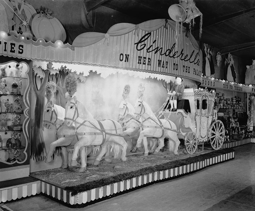 Cinderella's carriage drawn by six white horses at Blackler's toy fair at Fleet Street Warehouse, Christmas 1949. Credit: Stewart Bale / NML