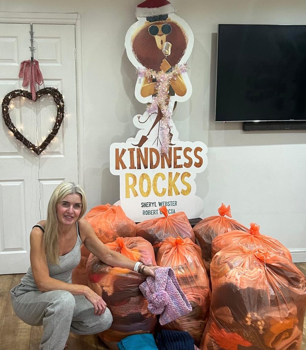 Sheryl with the bags of scarves ready to donate