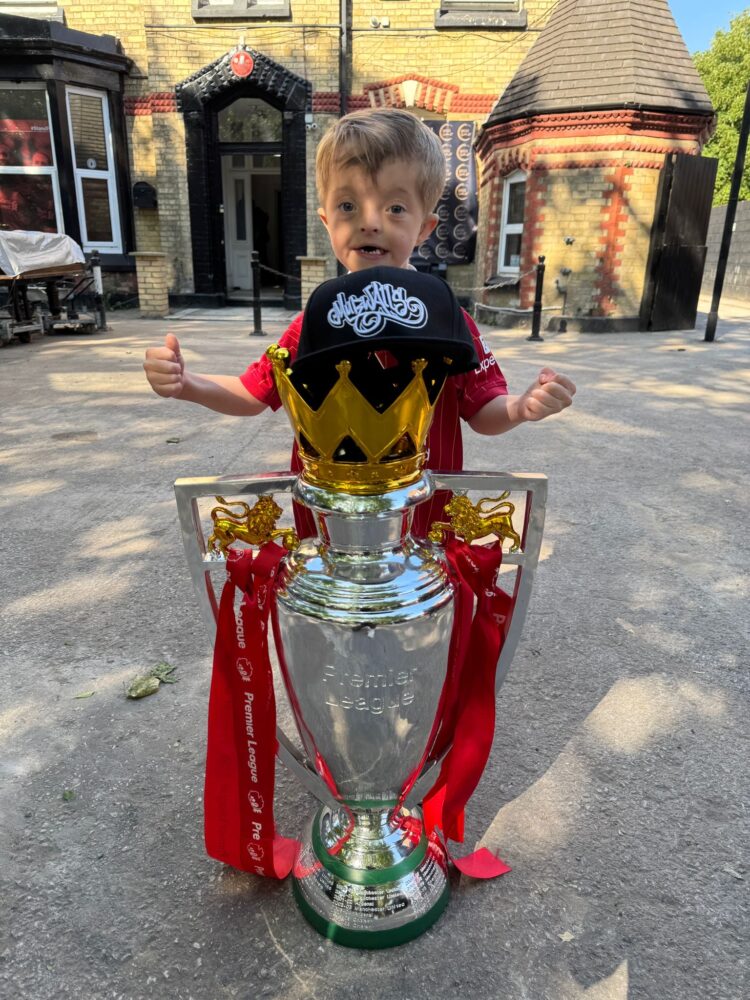 Isaac celebrating with a trophy!