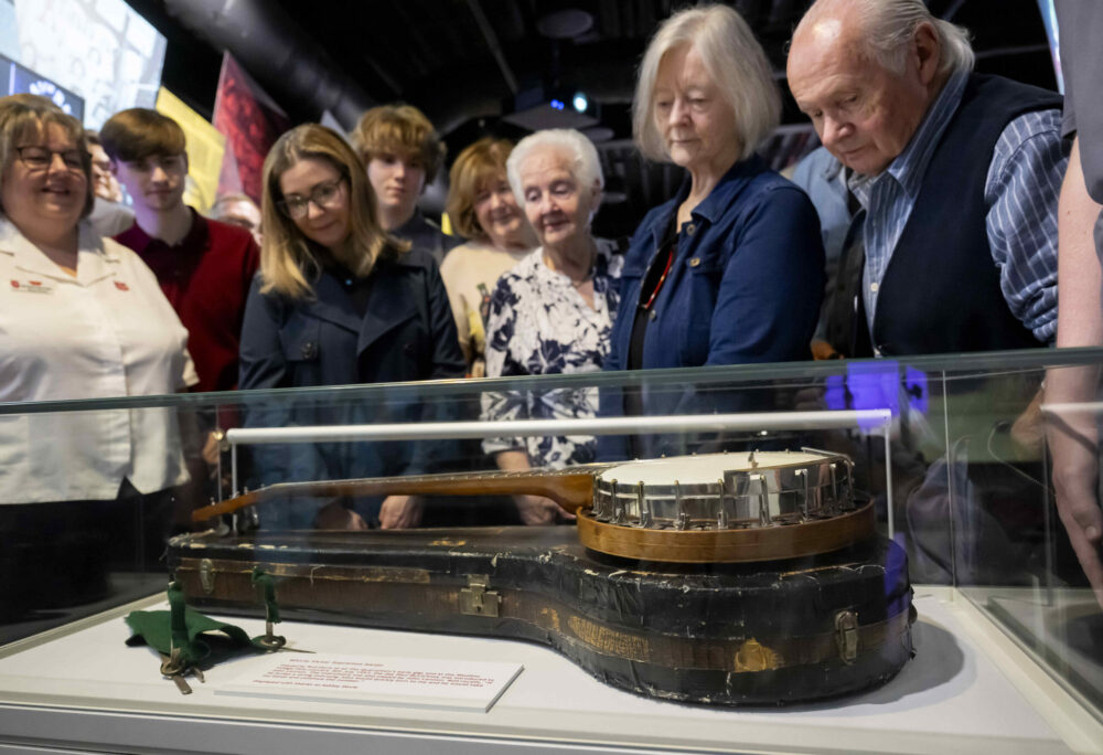 Quarrymen Banjo once played by John Lennon unveiled at Strawberry Field to mark his 85th birthday