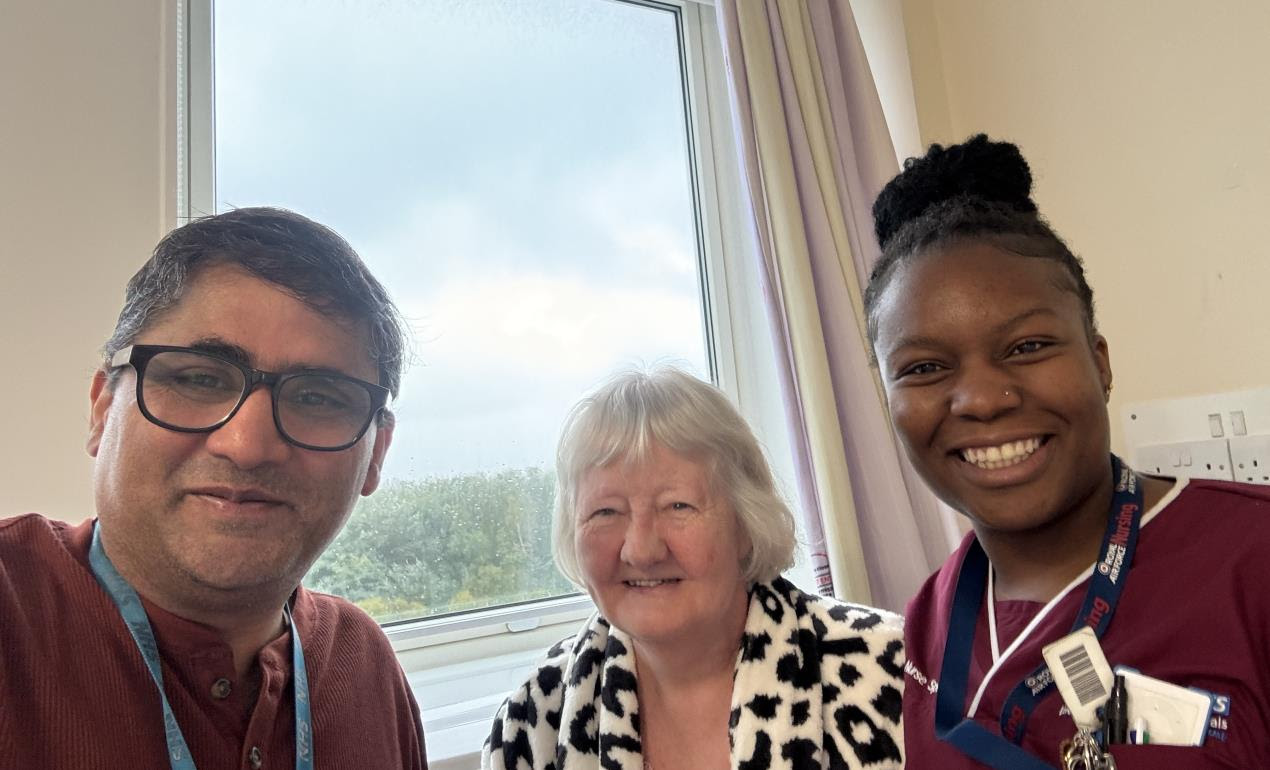 Mrs Stella Smeeton with Professor Shakil Ahmed and a member of the Colorectal team.