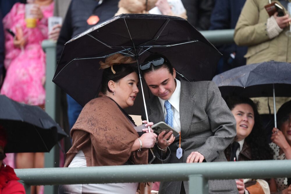 Crowds brave the elements at Aintree on the final day of the Grand National